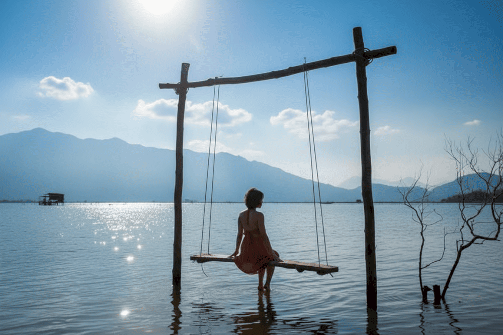 Surrounded by the majestic Bach Ma Mountains, this tranquil lagoon creates mirror-like reflections that double the beauty of dawn skies